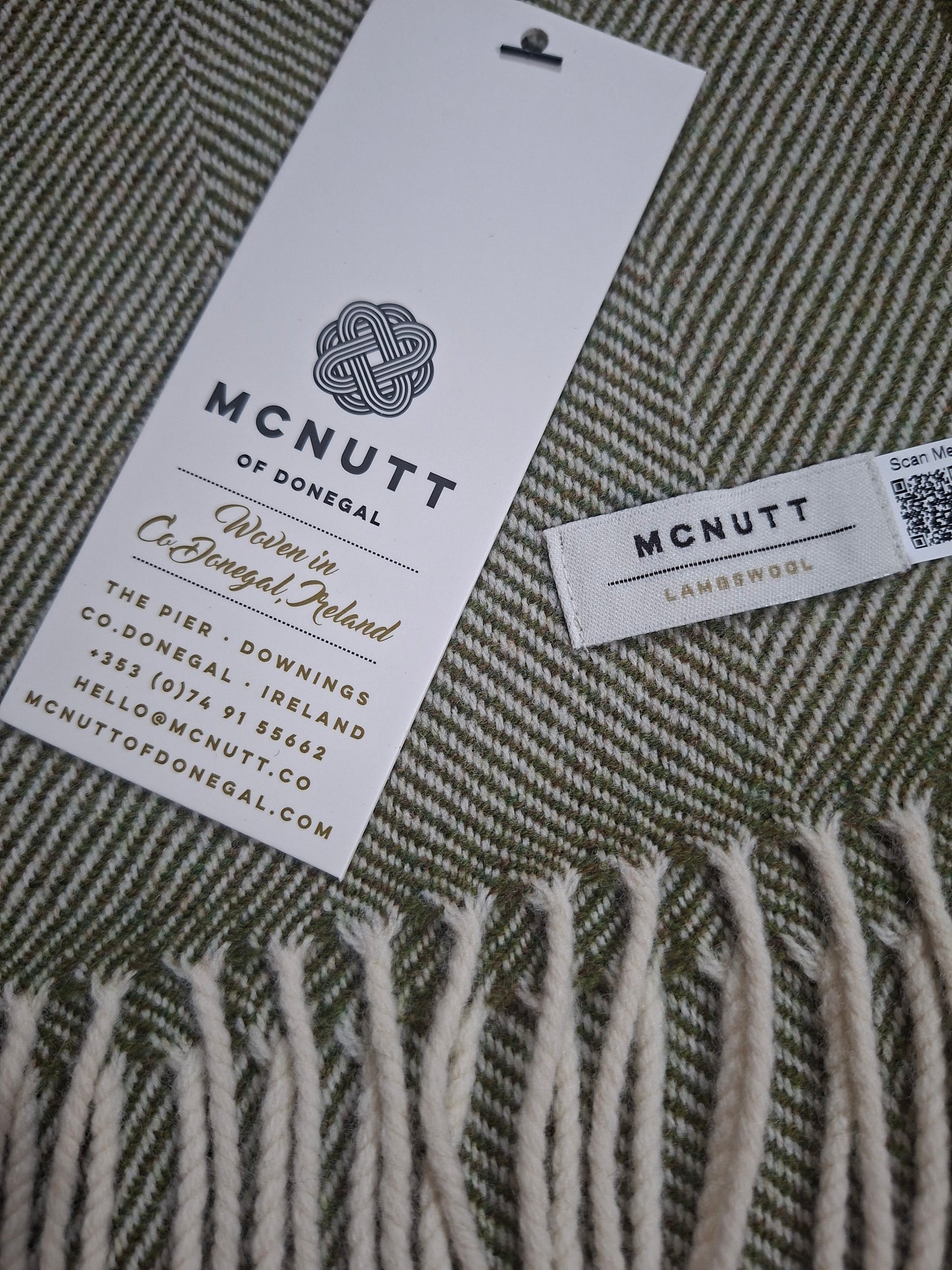 McNutt Landscape Herringbone Merino Lambswool Scarf, showing green woven pattern and fringed edge