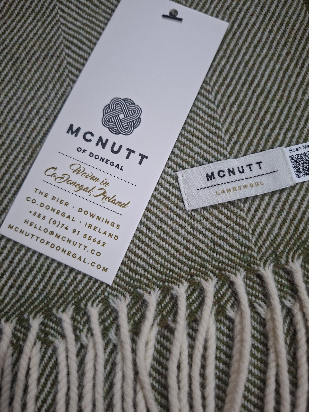 McNutt Landscape Herringbone Merino Lambswool Scarf, showing green woven pattern and fringed edge