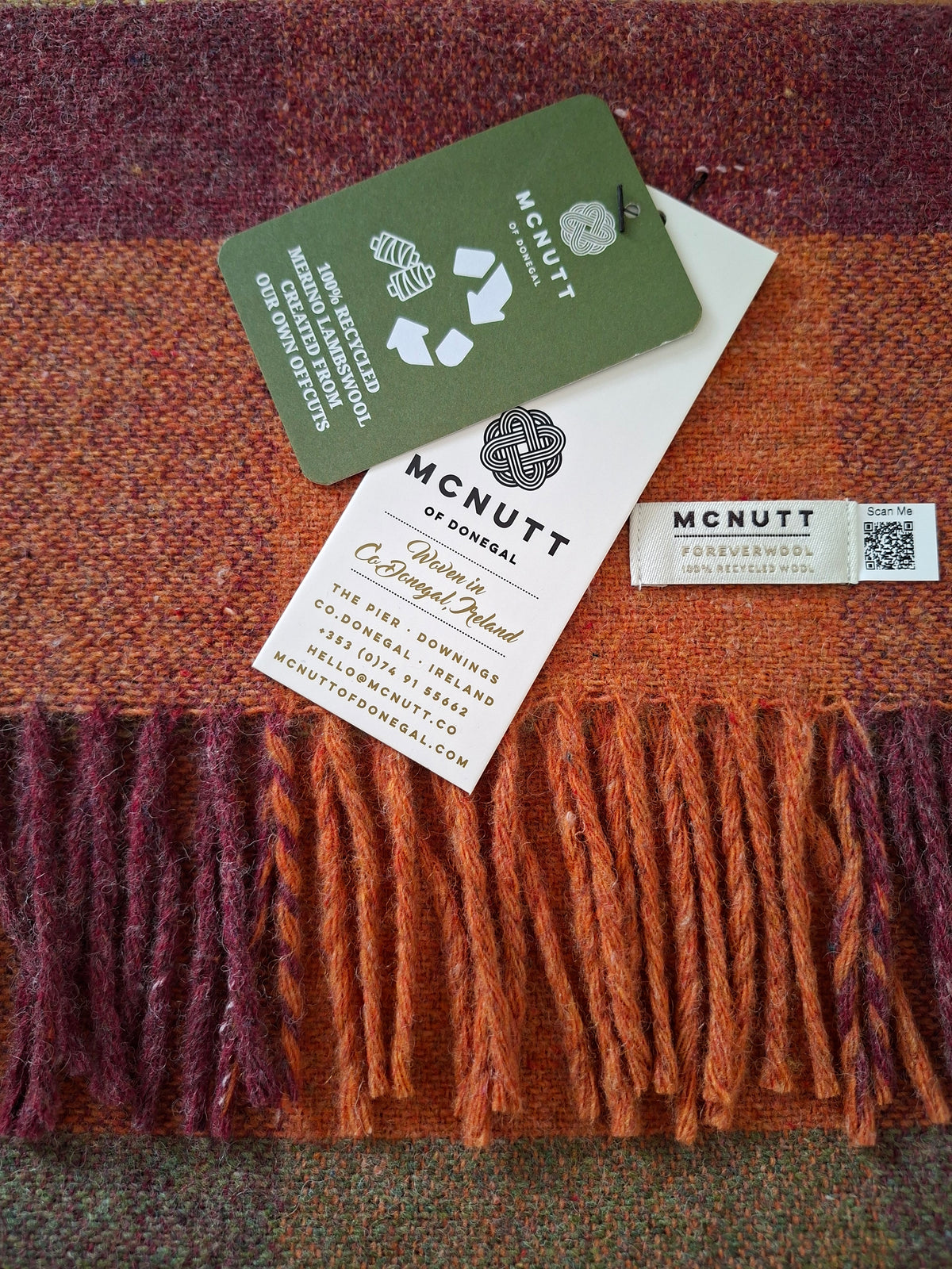 McNutt FOREVER recycled Merino wool Harvest Scarf in red, orange and green check.